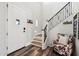 Stylish entryway featuring a staircase and elegant decor at 20518 W White Rock Rd, Buckeye, AZ 85396
