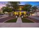 Charming home with a covered porch, balcony, lush landscaping, and an attached garage at 20518 W White Rock Rd, Buckeye, AZ 85396