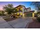 Charming home featuring a 2-car garage, balcony, and a well-manicured lawn at 20518 W White Rock Rd, Buckeye, AZ 85396
