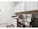 Functional laundry room equipped with a dog wash station and ample storage at 20518 W White Rock Rd, Buckeye, AZ 85396