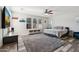Spacious main bedroom with neutral walls, ceiling fan, plantation shutters and hardwood floors at 20518 W White Rock Rd, Buckeye, AZ 85396