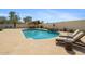 Inviting backyard pool with a waterfall feature, a gazebo, and lounge chairs at 20518 W White Rock Rd, Buckeye, AZ 85396