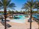 Serene community pool framed by tall palm trees, offering inviting lounge areas and clear blue water at 20518 W White Rock Rd, Buckeye, AZ 85396