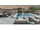 Stunning backyard with pool, lounge chairs, and covered seating areas, perfect for relaxation at 20518 W White Rock Rd, Buckeye, AZ 85396