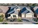 Aerial view of a well-maintained home with a lush front yard and a beautifully paved driveway at 22837 E Orchard Ln, Queen Creek, AZ 85142