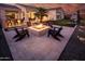 Inviting backyard featuring a fire pit and lounge seating, perfect for outdoor entertaining at 22837 E Orchard Ln, Queen Creek, AZ 85142