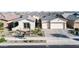 Charming single-Gathering home with a well-manicured front yard and a paved driveway at 22837 E Orchard Ln, Queen Creek, AZ 85142