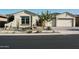Charming single-story home featuring desert landscaping, neutral stucco exterior, and a two-car garage at 22837 E Orchard Ln, Queen Creek, AZ 85142