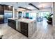 Stylish kitchen with a large island, stainless steel appliances, and ample cabinet space at 22837 E Orchard Ln, Queen Creek, AZ 85142