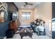 Entertainment room with leather recliners, a large TV, and neutral walls at 22837 E Orchard Ln, Queen Creek, AZ 85142