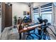 Functional home office with a large desk, professional video recording equipment, and modern decor accents at 22837 E Orchard Ln, Queen Creek, AZ 85142