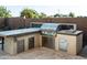 Outdoor kitchen featuring a stainless steel grill, countertop space, and storage at 22837 E Orchard Ln, Queen Creek, AZ 85142
