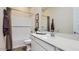 Clean bathroom with shower-tub combo, white subway tile, and solid surface vanity top at 23256 W Tamarisk Ave, Buckeye, AZ 85326