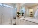 Modern bathroom with a glass-enclosed shower, dual sinks, and elegant fixtures for a spa-like experience at 23256 W Tamarisk Ave, Buckeye, AZ 85326