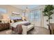 Inviting bedroom with a plush bed, ambient lighting, and serene decor for a relaxing atmosphere at 23256 W Tamarisk Ave, Buckeye, AZ 85326