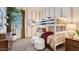 Fun bedroom featuring a bunk bed, playful decor, and soft lighting at 23256 W Tamarisk Ave, Buckeye, AZ 85326