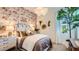 Bright bedroom featuring whimsical wallpaper, white trim, and large window at 23256 W Tamarisk Ave, Buckeye, AZ 85326