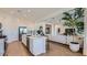 Open-concept kitchen with stainless steel appliances, white cabinetry, and large island at 23256 W Tamarisk Ave, Buckeye, AZ 85326