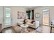 Chic living room with modern decor, stylish furnishings, and a light-filled ambiance at 23256 W Tamarisk Ave, Buckeye, AZ 85326