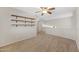 Upstairs bonus room with carpet flooring and a ceiling fan at 2511 W Blue Sky Dr, Phoenix, AZ 85085