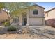 Inviting two-story home featuring a two-car garage and low maintenance desert landscaping at 2511 W Blue Sky Dr, Phoenix, AZ 85085
