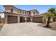 Spacious home featuring a three-car garage and tile roof at 2614 E Carob Dr, Gilbert, AZ 85298