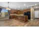 Well-equipped kitchen featuring wood cabinets, granite countertops, and stainless steel appliances at 2614 E Carob Dr, Gilbert, AZ 85298