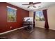 Office space with bright windows, ceiling fan, and hardwood floors at 2614 E Carob Dr, Gilbert, AZ 85298