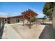 Backyard featuring a pergola, mature tree coverage, and direct access to the house at 2921 N 103Rd Ave, Avondale, AZ 85392