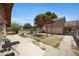 Inviting backyard with a wooden pergola and concrete patio, perfect for outdoor relaxation at 2921 N 103Rd Ave, Avondale, AZ 85392