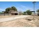 Two story barn on a large property with a cement driveway and ample space for additional parking at 2921 N 103Rd Ave, Avondale, AZ 85392
