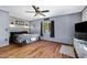Spacious bedroom features wood floors, modern lighting, and a decorative headboard at 2921 N 103Rd Ave, Avondale, AZ 85392