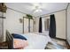 Bedroom with a queen bed, ceiling fan, closet, and large window at 2921 N 103Rd Ave, Avondale, AZ 85392