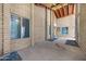 Covered patio area with decorative stonework and outdoor accents, ideal for relaxation and entertainment at 2921 N 103Rd Ave, Avondale, AZ 85392