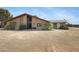 Charming brick home featuring a peaked roof, desert landscaping, and welcoming front entrance at 2921 N 103Rd Ave, Avondale, AZ 85392