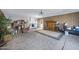 Open garage space with tiled floors, storage, and laundry area visible at 2921 N 103Rd Ave, Avondale, AZ 85392