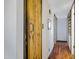 Hallway featuring wood flooring and access to other rooms within the home at 2921 N 103Rd Ave, Avondale, AZ 85392