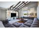 Comfortable living room featuring vaulted ceilings, modern furnishings, and abundant natural light at 2921 N 103Rd Ave, Avondale, AZ 85392