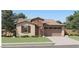 Charming single-story home featuring a neutral color palette, attached two-car garage, and a well-maintained lawn at 3283 E Ranchhand Dr, San Tan Valley, AZ 85140