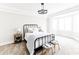Bright and airy primary bedroom features a metal bed frame, neutral decor, and a tray ceiling with recessed lighting at 3330 S Horizon Pl, Chandler, AZ 85248