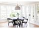 Bright dining area featuring a round table, modern black chairs, and large windows at 3330 S Horizon Pl, Chandler, AZ 85248