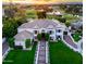 Beautiful exterior view of this home with lush landscaping and a view of the golf course at 3330 S Horizon Pl, Chandler, AZ 85248