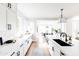 Bright kitchen featuring white cabinets, quartz counters, stainless appliances, and modern lighting at 3330 S Horizon Pl, Chandler, AZ 85248