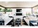 Inviting outdoor living area with comfortable seating, fireplace, and outdoor kitchen, perfect for entertaining guests at 3330 S Horizon Pl, Chandler, AZ 85248