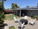Beautiful backyard with a paver patio, fire pit area, and covered patio for entertainment at 3615 E Hearn Rd, Phoenix, AZ 85032