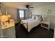 Comfortable bedroom featuring a metal frame bed, neutral walls, and a window with blinds for a restful retreat at 3615 E Hearn Rd, Phoenix, AZ 85032