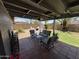 Inviting covered patio featuring comfortable seating area, perfect for outdoor relaxation and entertaining at 3615 E Hearn Rd, Phoenix, AZ 85032