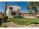 Large backyard featuring green grass, mature landscaping, covered patio, and pebble-tec pool at 3851 E San Pedro Ave, Gilbert, AZ 85234