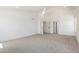 Spacious bedroom with white walls, carpet, and two entry doors at 3851 E San Pedro Ave, Gilbert, AZ 85234