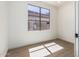 Bright bedroom with hard floors and a sunny window at 3851 E San Pedro Ave, Gilbert, AZ 85234
